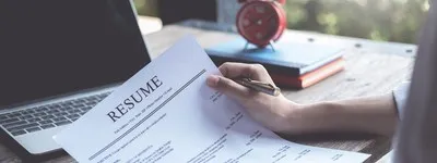 photo of a person reading their resume