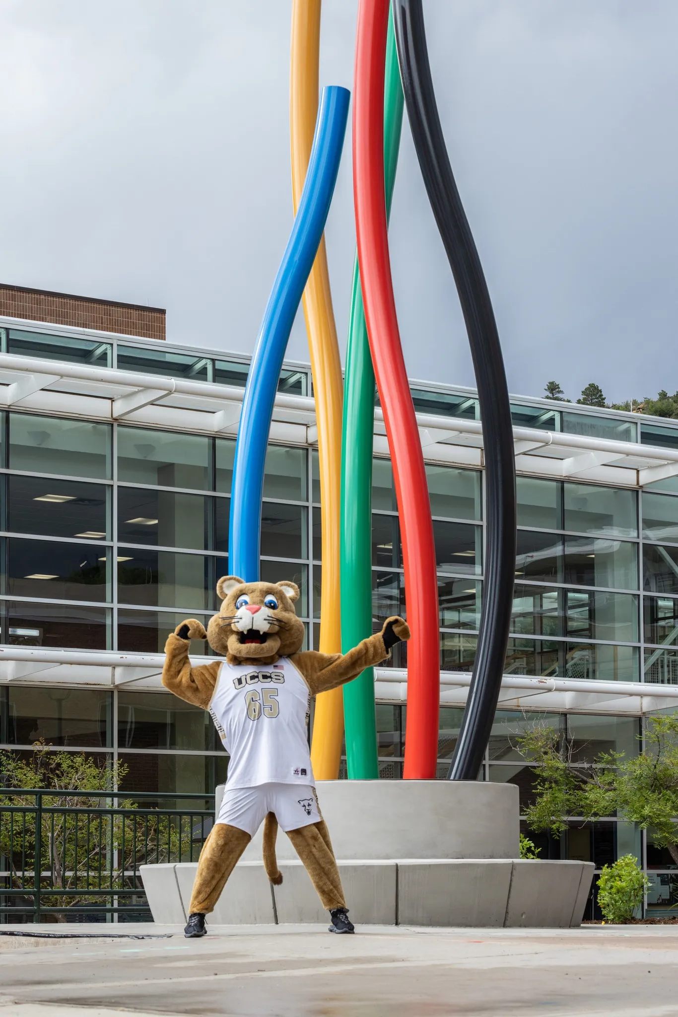 Clyde next to the olympic flame statue